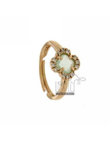 A flower ring with green...